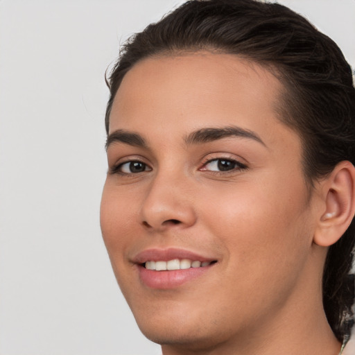 Joyful white young-adult female with medium  brown hair and brown eyes