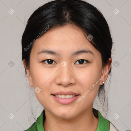 Joyful asian young-adult female with medium  brown hair and brown eyes