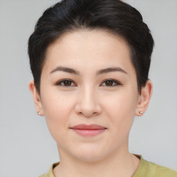 Joyful asian young-adult female with short  brown hair and brown eyes