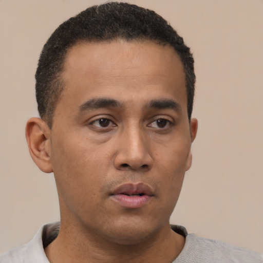 Neutral latino young-adult male with short  black hair and brown eyes