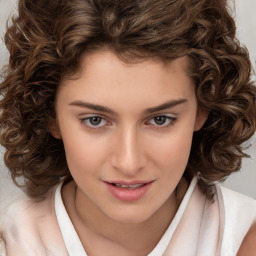 Joyful white child female with medium  brown hair and brown eyes