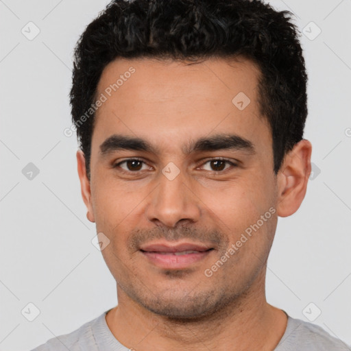 Joyful white young-adult male with short  black hair and brown eyes