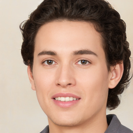 Joyful white young-adult male with medium  brown hair and brown eyes