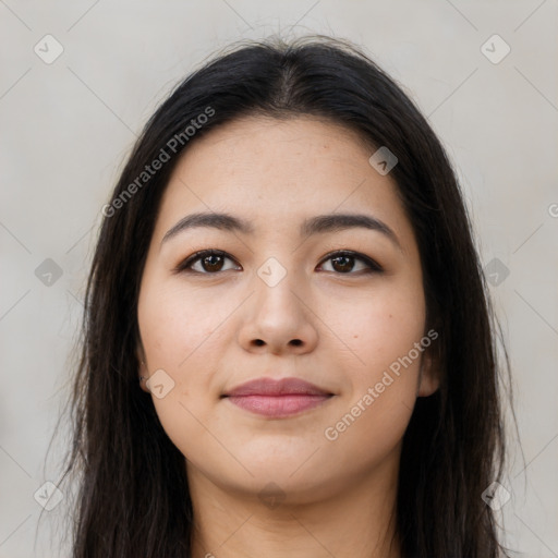 Joyful latino young-adult female with long  brown hair and brown eyes