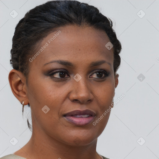 Joyful black young-adult female with short  brown hair and brown eyes