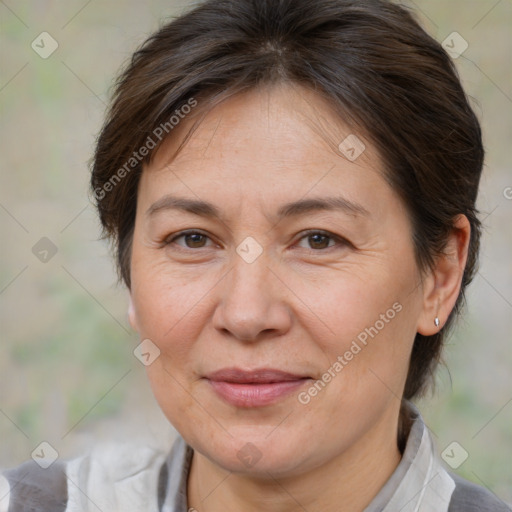 Joyful white adult female with medium  brown hair and brown eyes