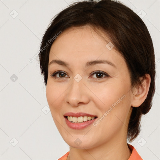 Joyful white young-adult female with medium  brown hair and brown eyes