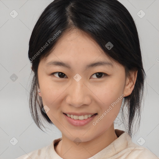 Joyful asian young-adult female with medium  black hair and brown eyes