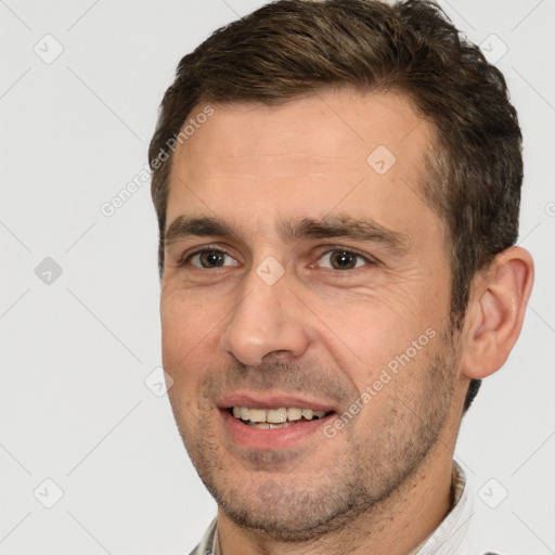 Joyful white adult male with short  brown hair and brown eyes