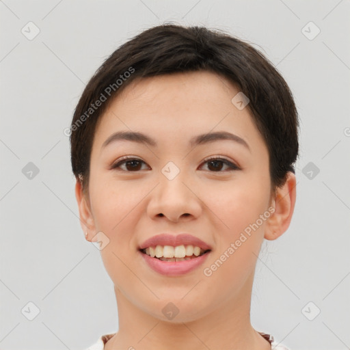 Joyful asian young-adult female with short  brown hair and brown eyes