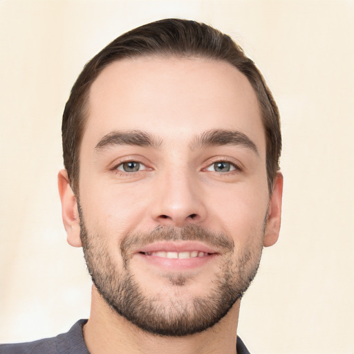 Joyful white young-adult male with short  brown hair and brown eyes