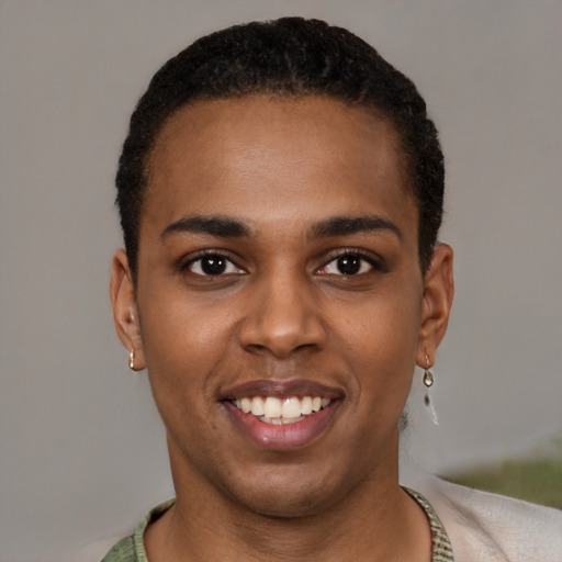 Joyful black young-adult male with short  brown hair and brown eyes