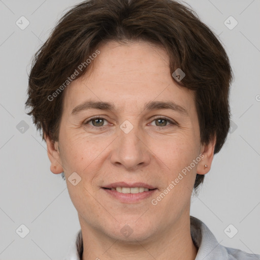 Joyful white adult female with short  brown hair and brown eyes