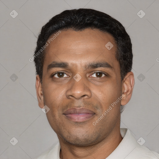 Joyful black young-adult male with short  black hair and brown eyes