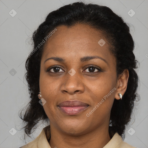 Joyful black adult female with medium  black hair and brown eyes