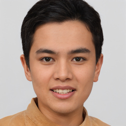 Joyful asian young-adult male with short  brown hair and brown eyes