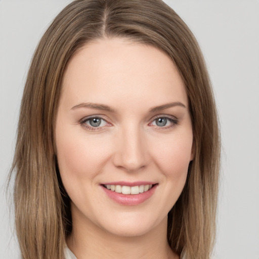 Joyful white young-adult female with long  brown hair and grey eyes