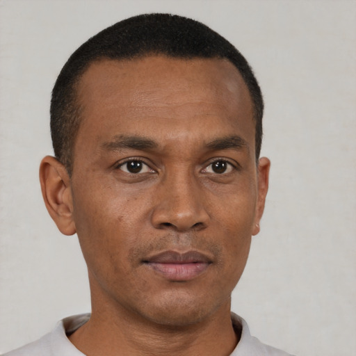 Neutral black adult male with short  black hair and brown eyes