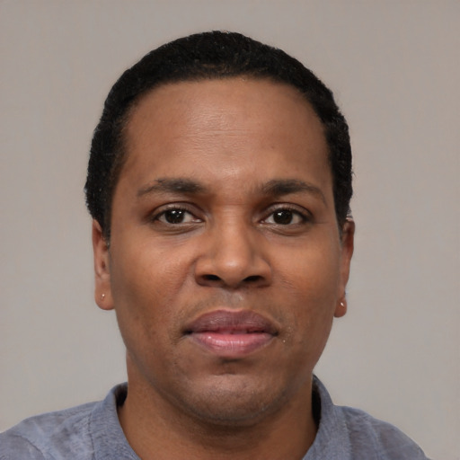Neutral latino adult male with short  black hair and brown eyes