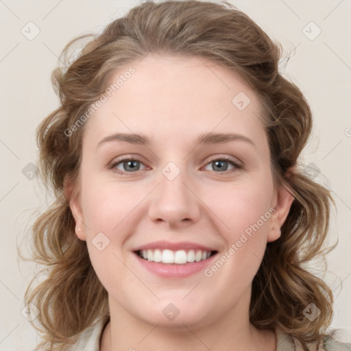 Joyful white young-adult female with medium  brown hair and blue eyes