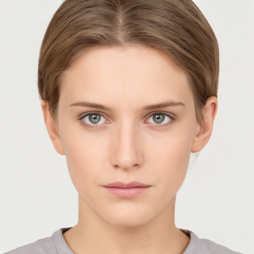 Neutral white young-adult female with short  brown hair and grey eyes