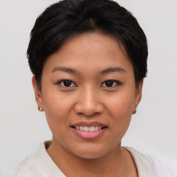 Joyful asian young-adult female with short  brown hair and brown eyes