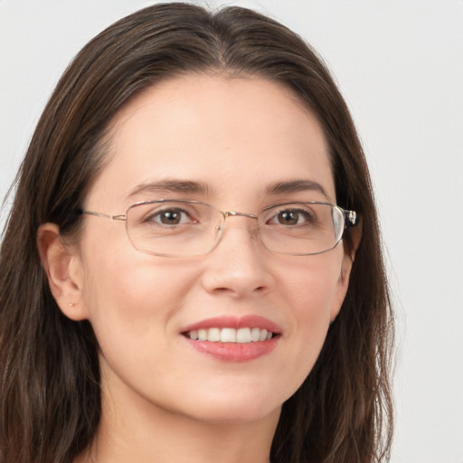 Joyful white young-adult female with long  brown hair and grey eyes