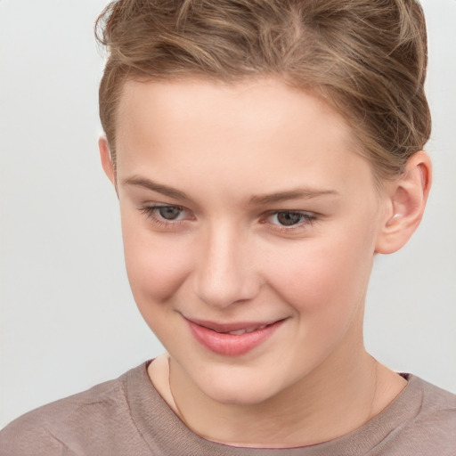 Joyful white child female with short  brown hair and grey eyes