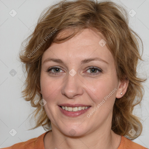 Joyful white young-adult female with medium  brown hair and blue eyes