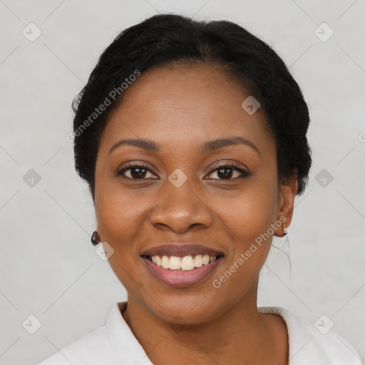 Joyful black young-adult female with short  black hair and brown eyes