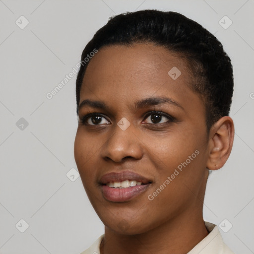 Joyful black young-adult female with short  black hair and brown eyes