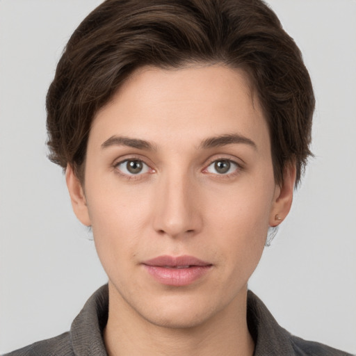 Neutral white young-adult female with short  brown hair and brown eyes