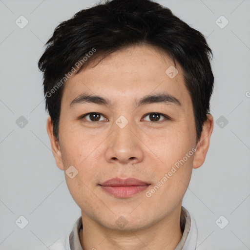 Joyful asian young-adult male with short  black hair and brown eyes