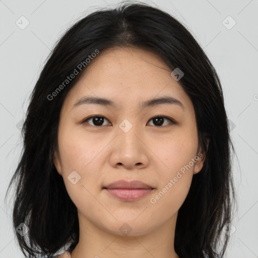 Joyful asian young-adult female with long  brown hair and brown eyes