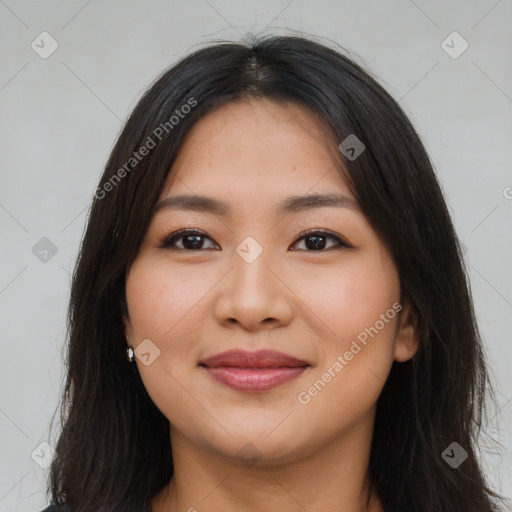 Joyful latino young-adult female with long  brown hair and brown eyes