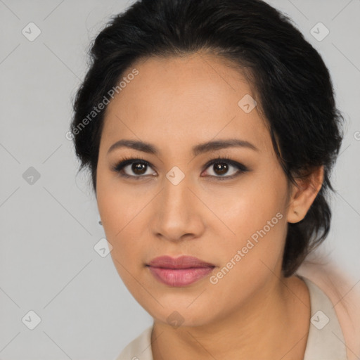 Joyful latino young-adult female with medium  brown hair and brown eyes