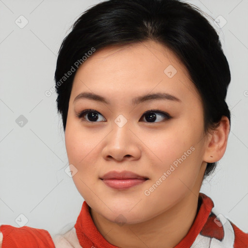 Joyful asian young-adult female with medium  black hair and brown eyes