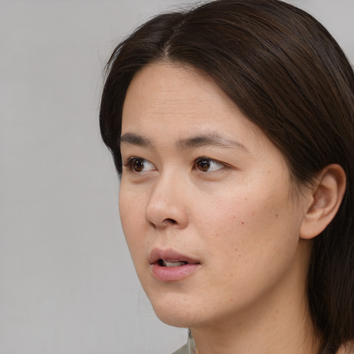 Neutral white young-adult female with short  brown hair and brown eyes