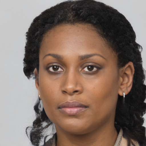 Neutral black young-adult female with long  black hair and brown eyes