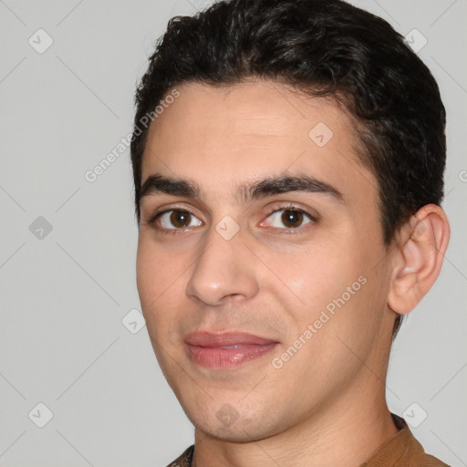 Joyful white young-adult male with short  black hair and brown eyes