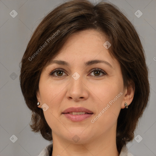 Joyful white adult female with medium  brown hair and brown eyes