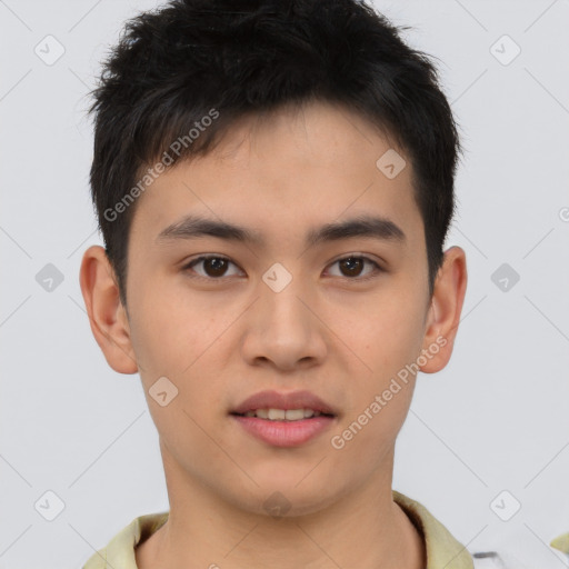 Joyful asian young-adult male with short  brown hair and brown eyes