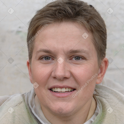 Joyful white adult female with short  brown hair and grey eyes