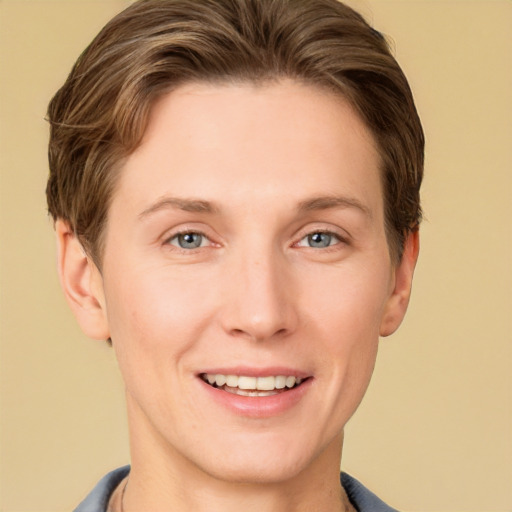 Joyful white young-adult female with short  brown hair and grey eyes