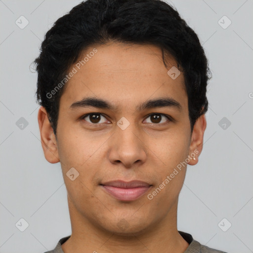 Joyful latino young-adult male with short  brown hair and brown eyes