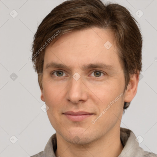 Joyful white adult male with short  brown hair and grey eyes