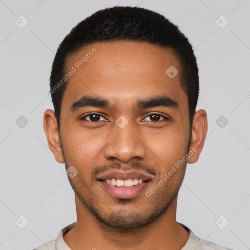 Joyful latino young-adult male with short  black hair and brown eyes