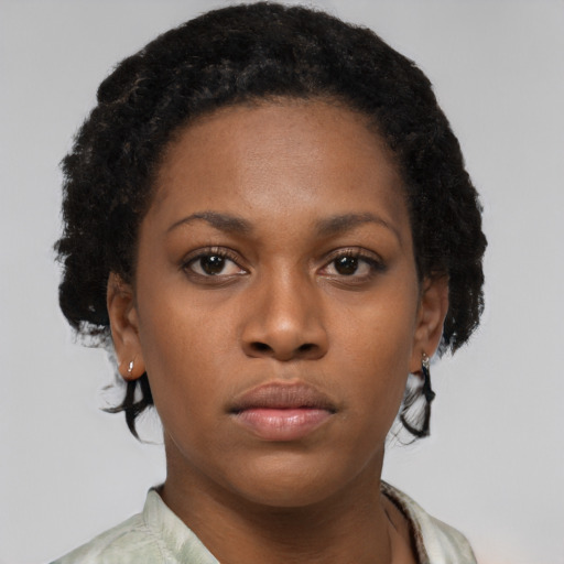 Neutral black young-adult female with short  brown hair and brown eyes