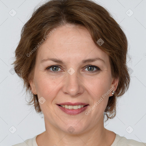 Joyful white adult female with medium  brown hair and grey eyes