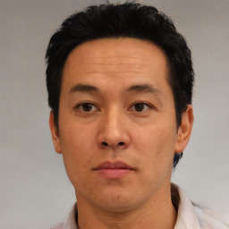 Neutral asian adult male with short  black hair and brown eyes